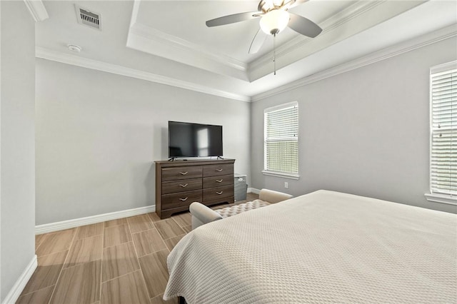 7209 Lake Tranquility Dr, Corpus Christi, TX 78414 - bedroom featuring a raised ceiling, wood tiled floors, a ceiling fan, and crown molding