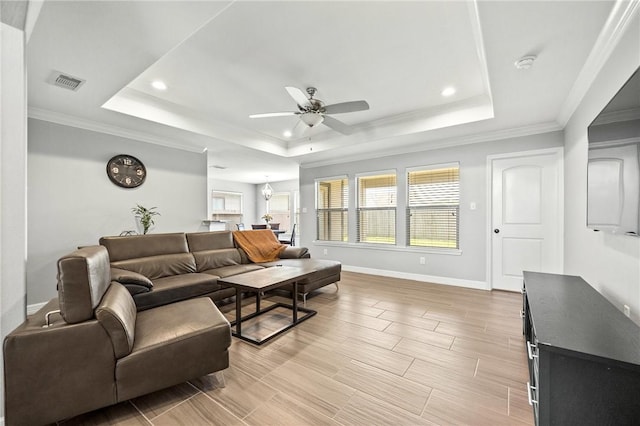 7209 Lake Tranquility Dr, Corpus Christi, TX 78414 - living room with a raised ceiling, a ceiling fan, recessed lighting, wood finish floors, and crown molding
