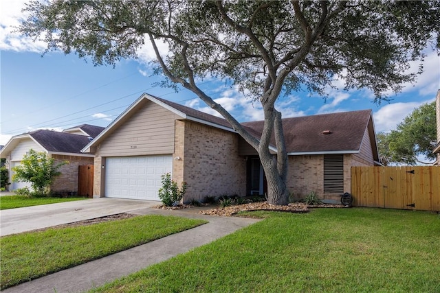 single story home featuring a front lawn and a garage