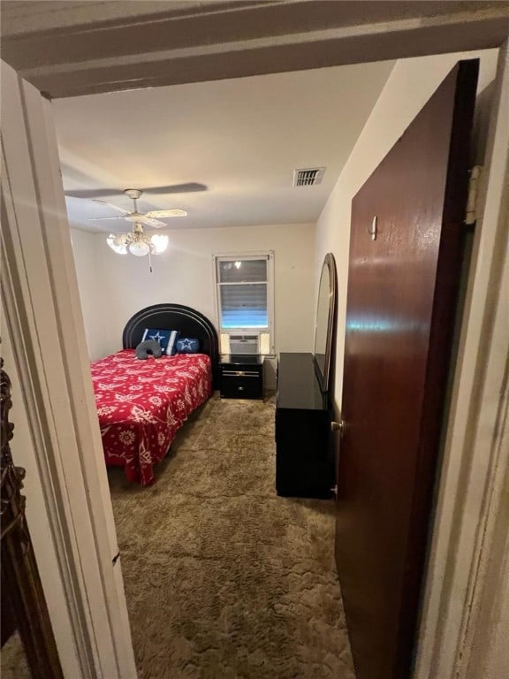 carpeted bedroom with ceiling fan