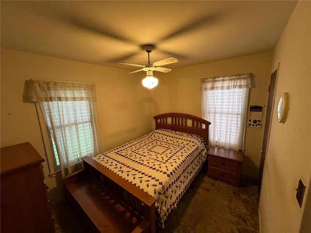 carpeted bedroom with ceiling fan