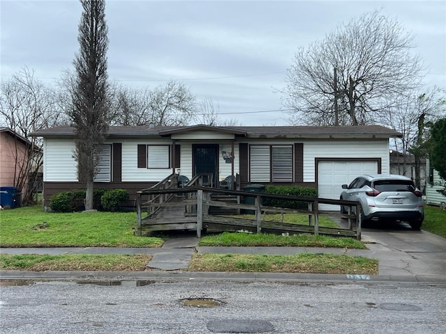 ranch-style home with a garage and a front yard