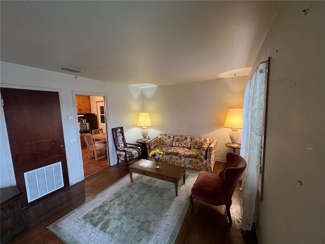 living room with dark wood-type flooring