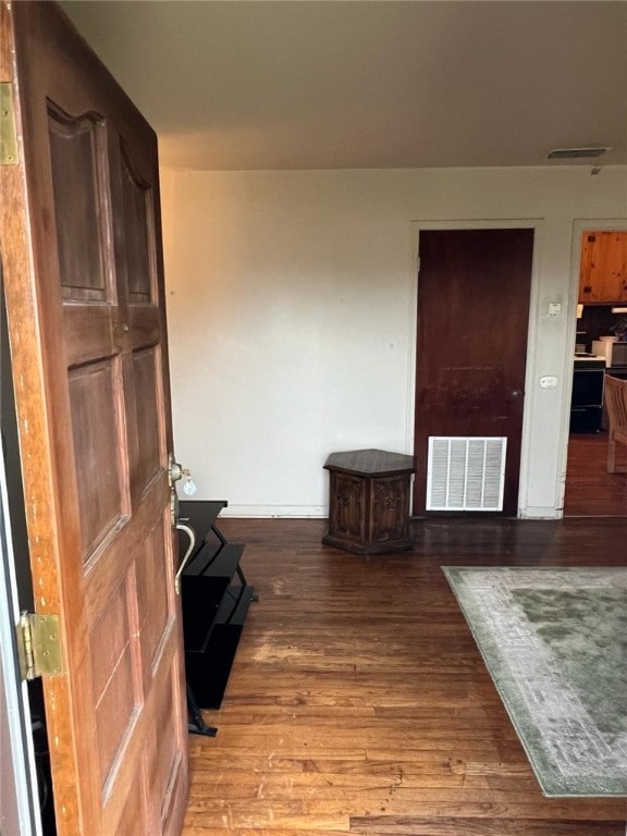 hallway featuring hardwood / wood-style floors