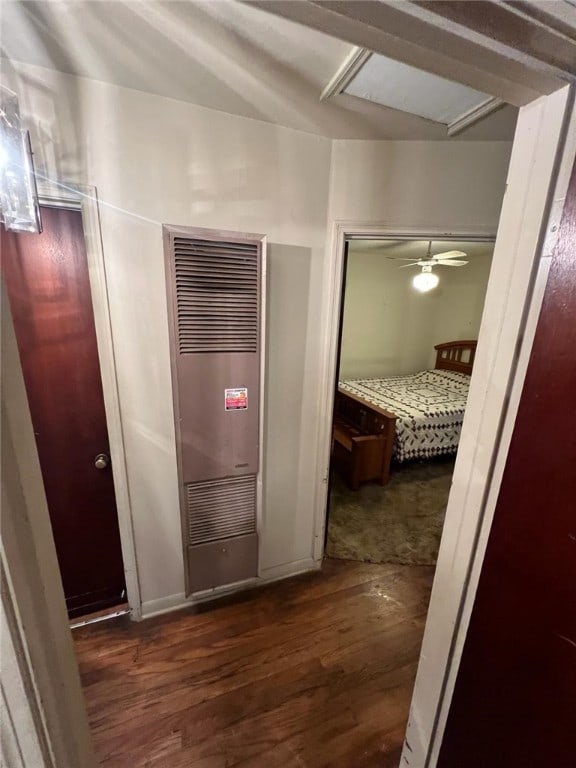 corridor featuring dark hardwood / wood-style floors