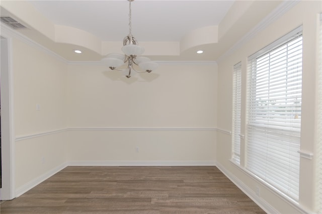 empty room with a chandelier, wood-type flooring, and ornamental molding