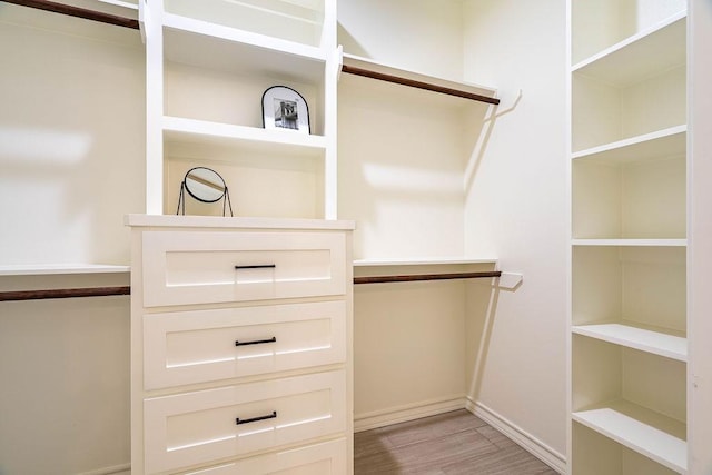 walk in closet featuring light wood-style floors