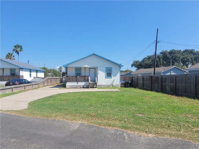 rear view of house featuring cooling unit, a yard, and a wooden deck