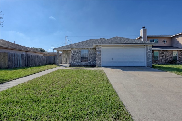 ranch-style home featuring a front yard and a garage