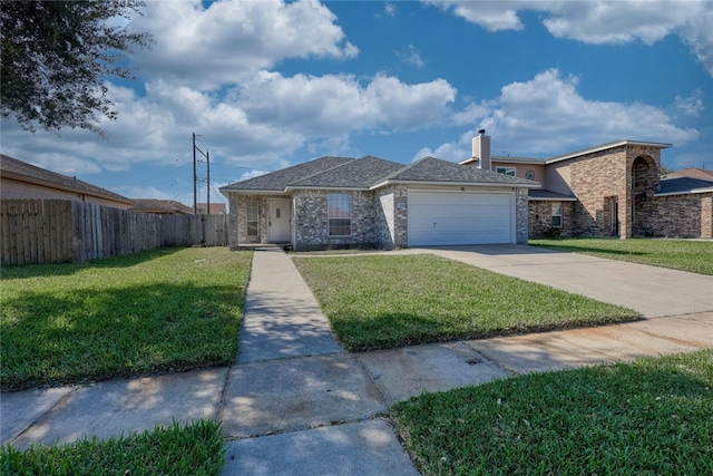 view of front of home with a front lawn and a garage