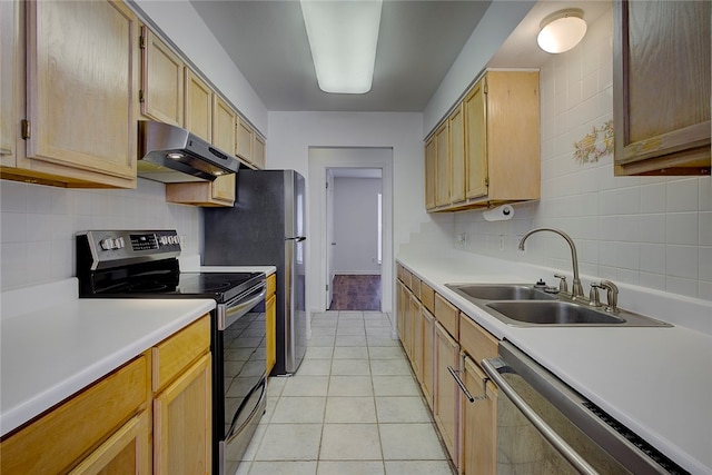 kitchen with tasteful backsplash, stainless steel appliances, sink, light tile patterned floors, and light brown cabinets