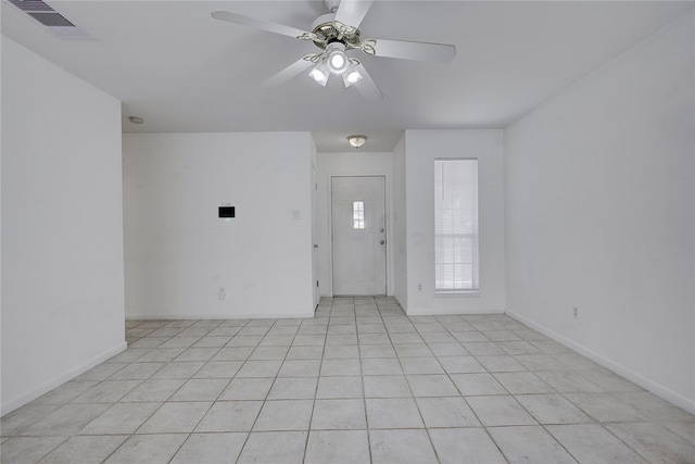 foyer featuring ceiling fan and light tile patterned flooring