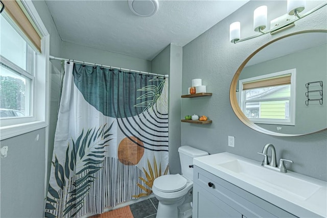 bathroom featuring a shower with shower curtain, toilet, tile patterned floors, a textured ceiling, and vanity