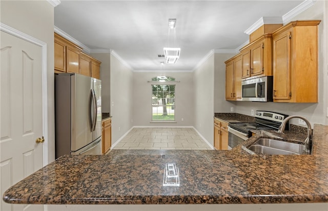 3613 Berkeley Dr, Corpus Christi, TX 78414 - kitchen with stainless steel appliances, light tile patterned floors, dark stone countertops, ornamental molding, and a peninsula