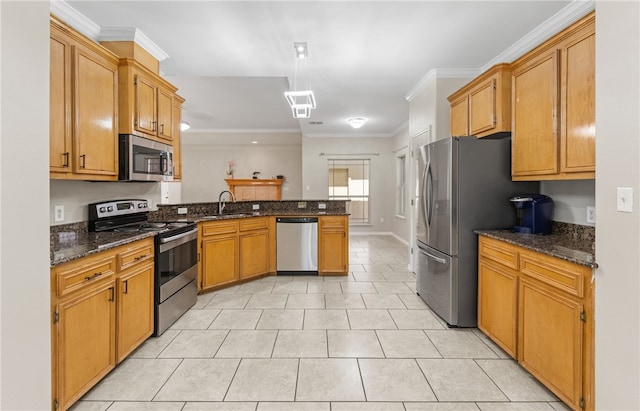3613 Berkeley Dr, Corpus Christi, TX 78414 - kitchen featuring stainless steel appliances, a peninsula, light tile patterned floors, crown molding, and dark stone countertops