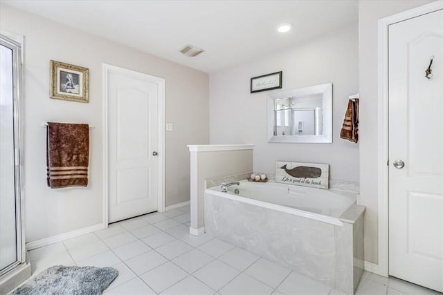 full bath with a garden tub, baseboards, tile patterned flooring, and recessed lighting