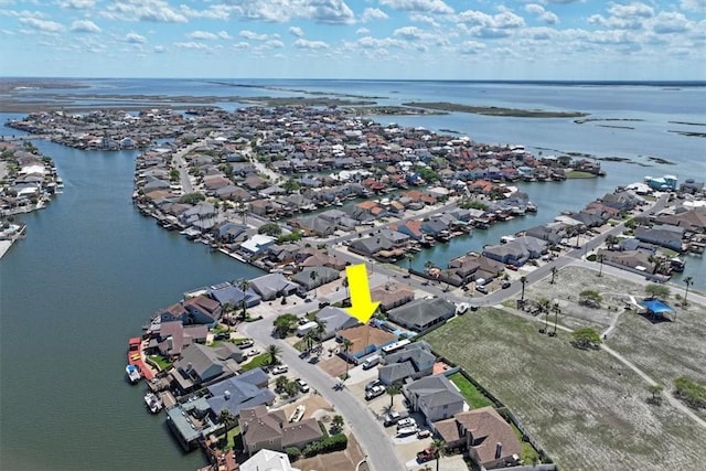 aerial overview of property's location featuring a nearby body of water and nearby suburban area