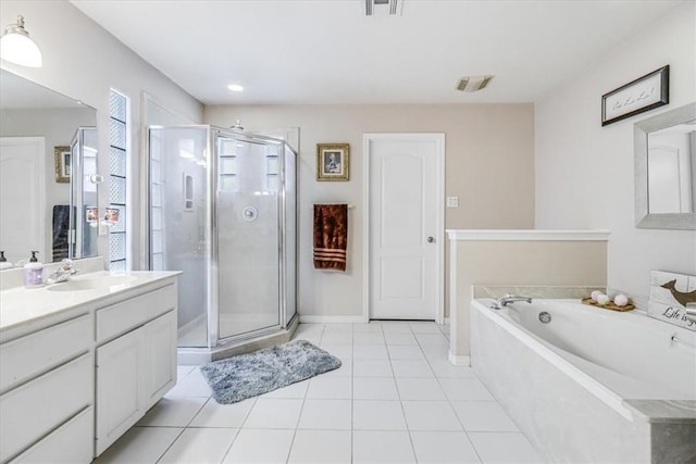 full bathroom featuring vanity, a stall shower, tile patterned flooring, and a bath
