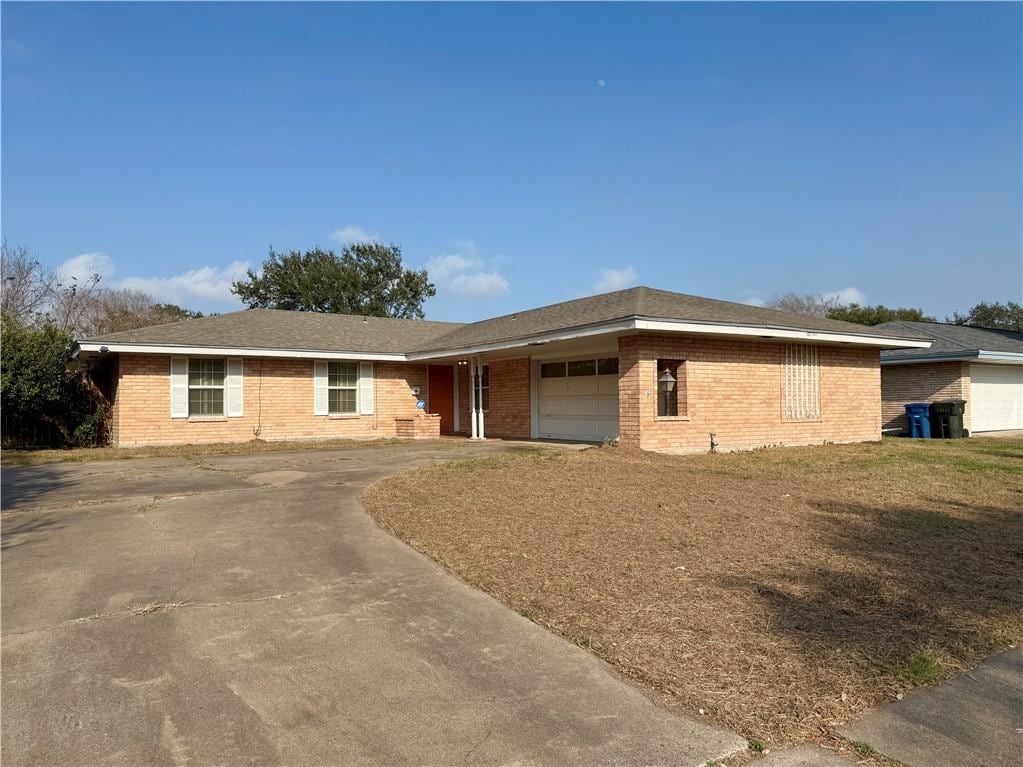 ranch-style house featuring a garage