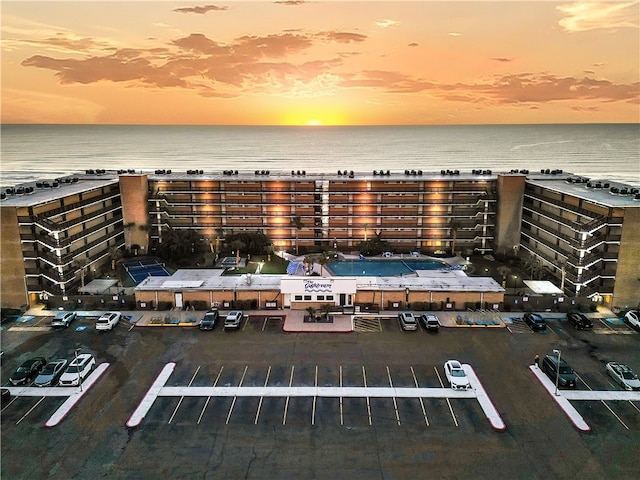 aerial view at dusk with a water view