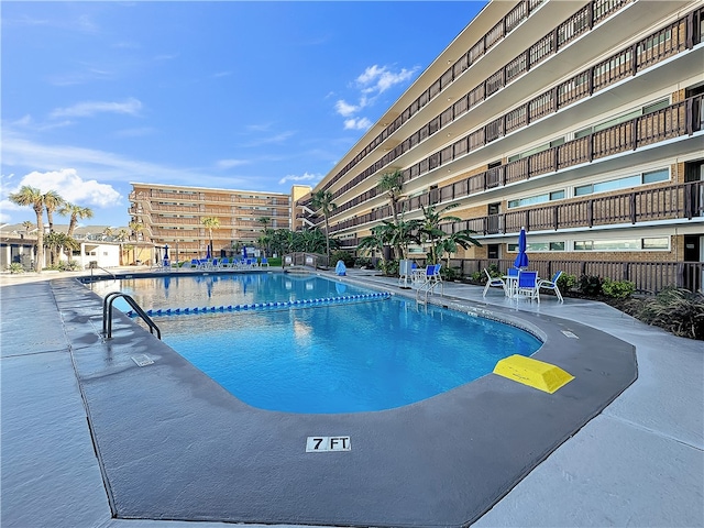 view of pool featuring a patio