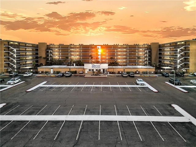 view of parking at dusk