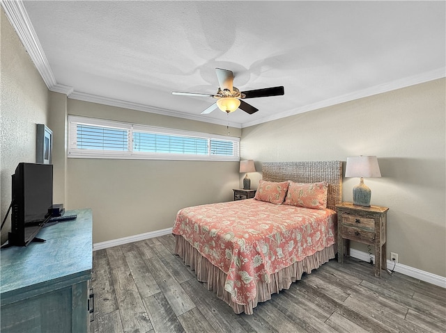 bedroom with hardwood / wood-style floors, a textured ceiling, ceiling fan, and ornamental molding