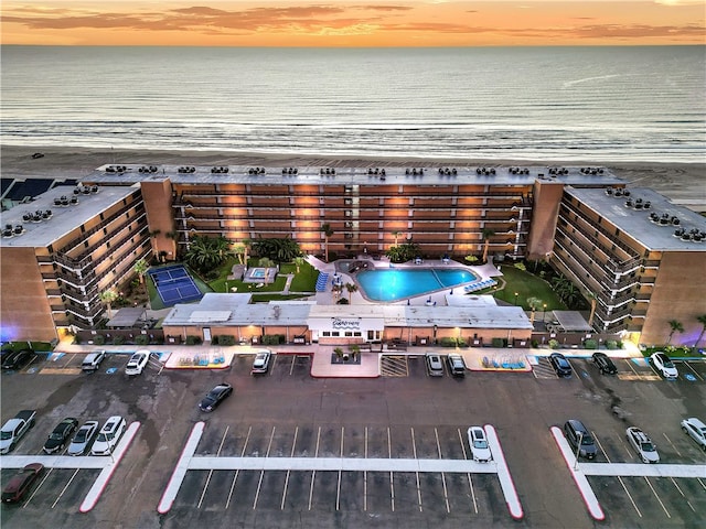 aerial view at dusk with a water view