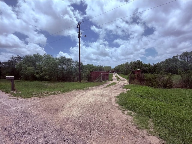 5742 Hidden Valley Loop, Sandia, TX 78383 - view of dirt / gravel driveway featuring a gated entry