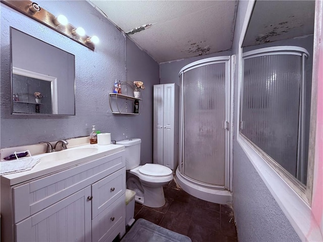5742 Hidden Valley Loop, Sandia, TX 78383 - full bath featuring a shower stall, vanity, a textured wall, and a textured ceiling