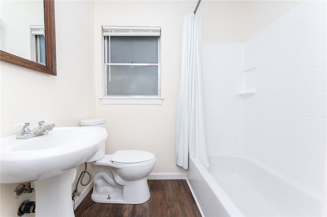 3606 Marion St, Corpus Christi, TX 78415 - bathroom with shower / bath combination with curtain and wood finished floors