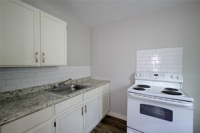 kitchen featuring white cabinetry, white electric range, sink, and tasteful backsplash