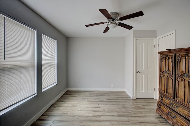 unfurnished room featuring ceiling fan and light hardwood / wood-style flooring