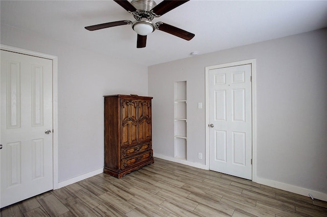 bedroom featuring light hardwood / wood-style floors and ceiling fan