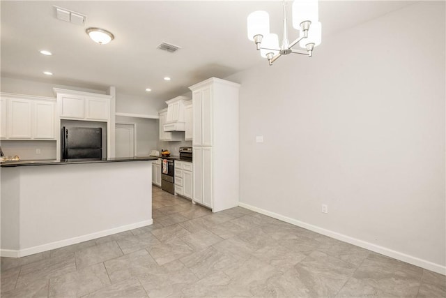 kitchen with decorative light fixtures, white cabinetry, stainless steel range with electric cooktop, black fridge, and an inviting chandelier