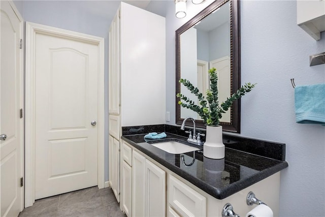 bathroom featuring tile patterned floors and vanity