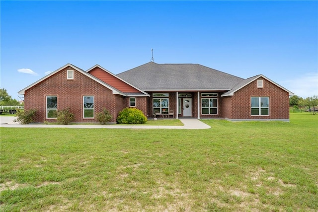 ranch-style house featuring a front lawn