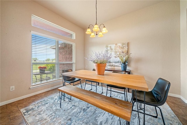 dining space featuring a notable chandelier