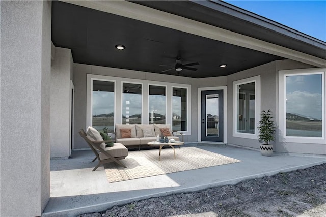 view of patio featuring an outdoor hangout area and ceiling fan