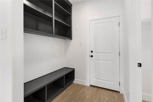 mudroom with light wood-type flooring and baseboards