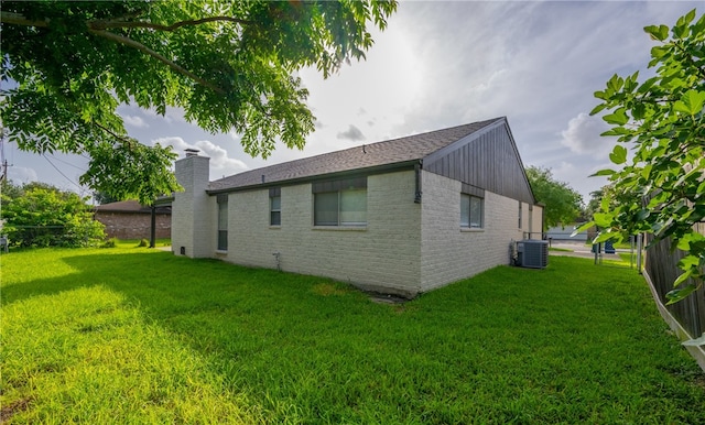 6905 Braesvalley Dr, Corpus Christi, TX 78413 - back of house featuring brick siding, a chimney, and roof with shingles