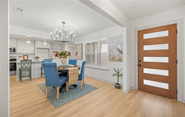 6905 Braesvalley Dr, Corpus Christi, TX 78413 - dining area featuring a chandelier and light wood finished floors