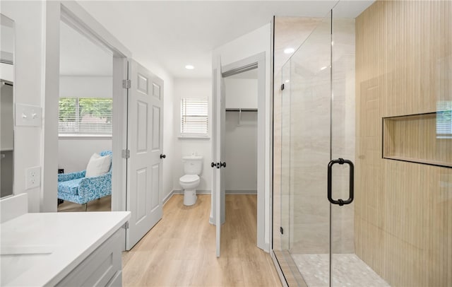 6905 Braesvalley Dr, Corpus Christi, TX 78413 - full bath with a shower stall, wood finished floors, vanity, and ensuite bath