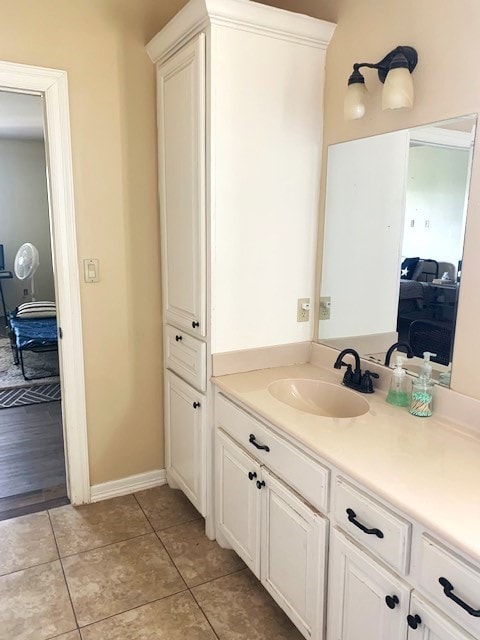 bathroom with tile patterned flooring and vanity