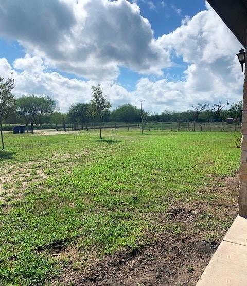 view of yard with a rural view