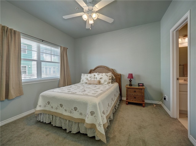 carpeted bedroom with ceiling fan and ensuite bathroom