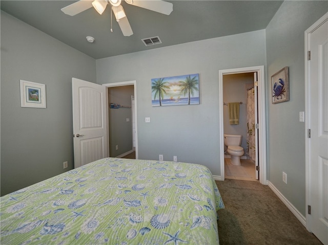 bedroom featuring ceiling fan, ensuite bath, and carpet floors