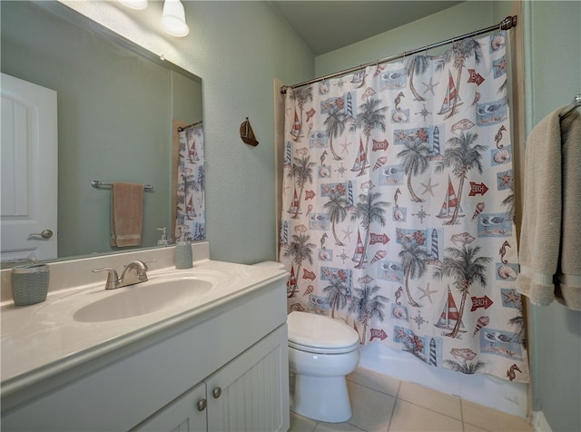 bathroom featuring toilet, vanity, and tile patterned floors