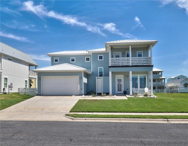 view of front of home with a front lawn, a balcony, and a garage