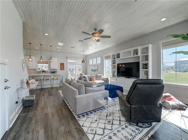 living room featuring dark wood-type flooring, wood ceiling, and ceiling fan